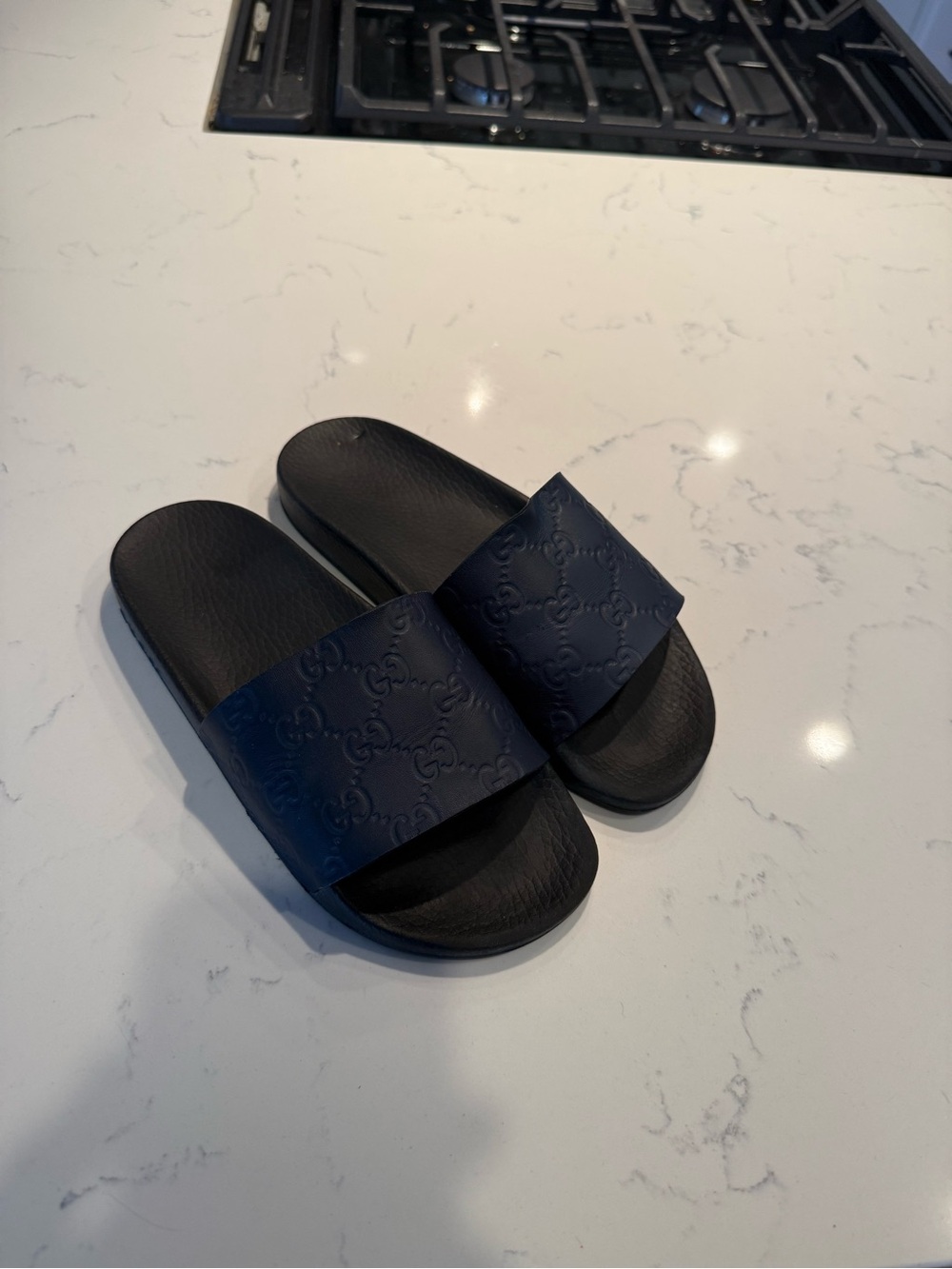 Gucci Black Embossed Logo Slide Sandals
